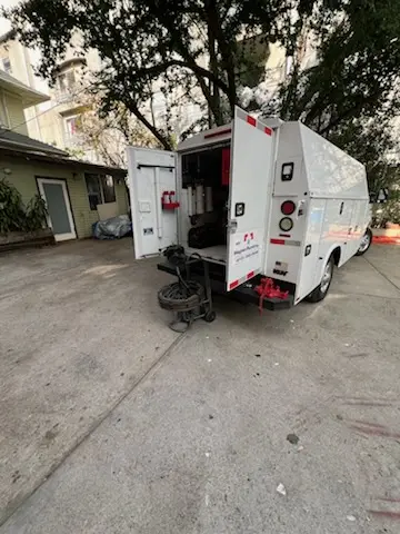 Magnet Plumbing service vehicle on-site for Grease Trap Cleaning in La Patera
